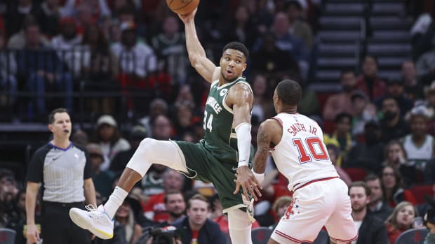 Milwaukee Bucks forward Giannis Antetokounmpo (34) catches a pass as Houston Rockets forward Jabari Smith Jr. (10) defends during the fourth quarter at Toyota Center.